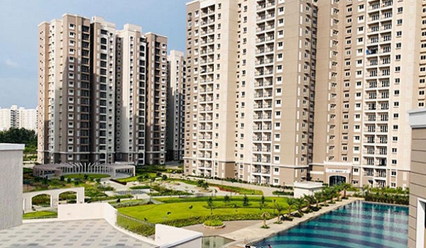Landscaped gardens and entrance of a Prestige residential project in East Bangalore